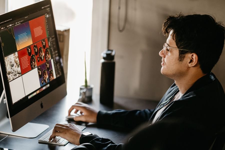 A designer building a website layout on screen